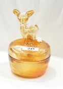 Set of three marigold carnival glass jars and covers with animal finials depicting a poodle,
