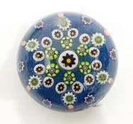 Glass paperweight with millefiori canes modelled as butterflies and flowerheads and four other