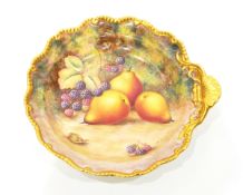 20th century Royal Worcester porcelain plate of circular shaped form with shell handle,
