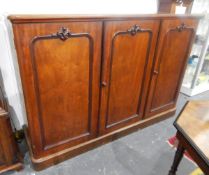 Victorian mahogany linen cupboard, the three panel doors enclosing sliding trays,