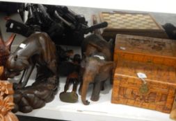 Quantity of carved wooden models of elephants, African figures, boxes, etc.