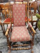 Late 19th century American rocking chair with turned supports, upholstered back and seat,