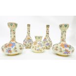 Suite of Victorian opaque glass vases comprising two pairs of bottle vases and a smaller squat vase,