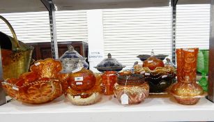 Large quantity of marigold carnival glass including rose bowl, pin dishes, fruit bowls,
