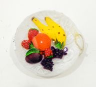 Glass paperweight by John Deacons of circular form depicting fruit on a scrambled white latticino