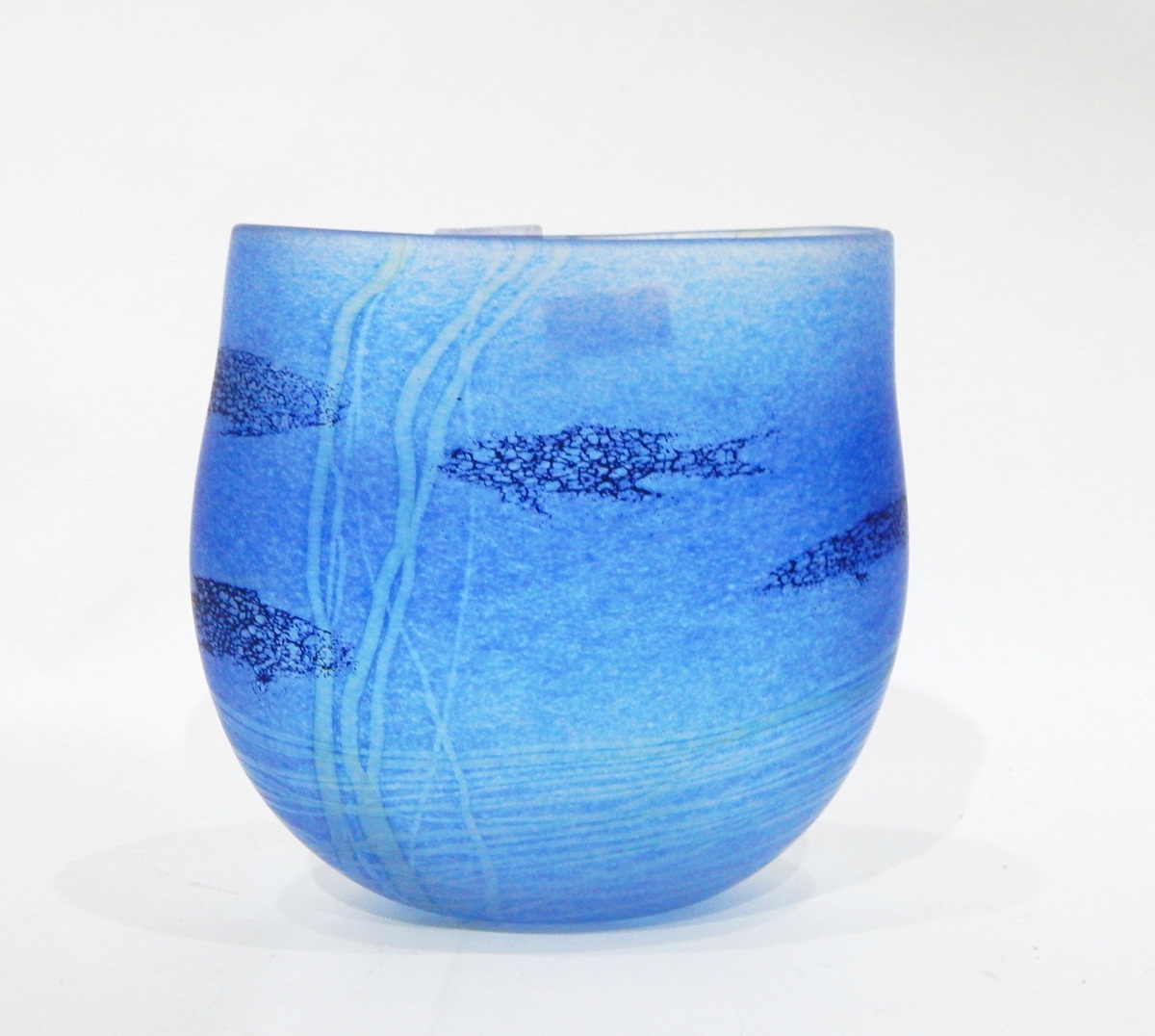 Modern glass vase by Siddy Langley of oval form, decorated with fish and reeds on a blue ground,