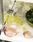 Collection of seven Victorian pressed glass swans including two graduated pink opaline glass swans