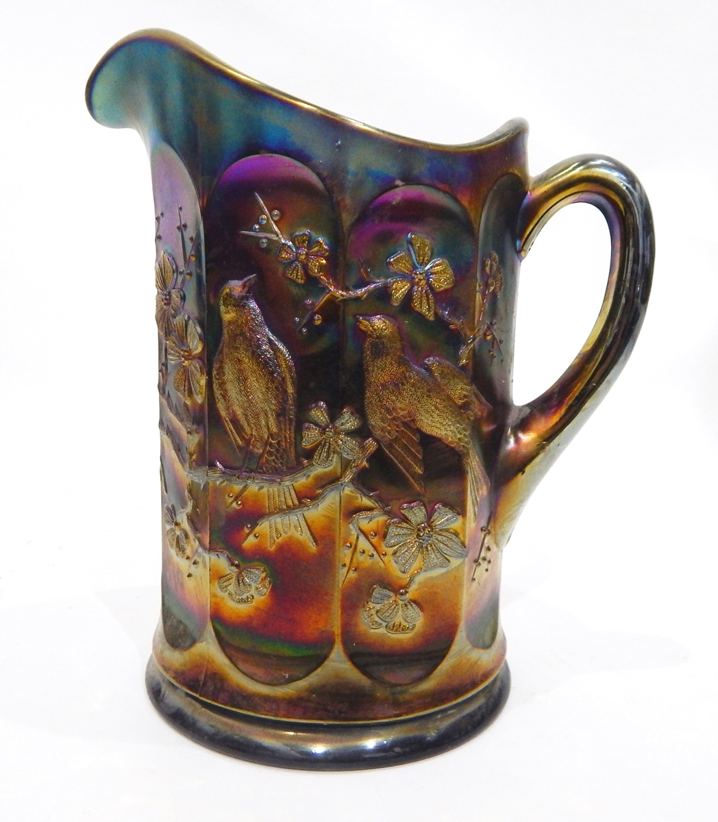 Collection of amethyst carnival glass including a comport with moulded decoration of butterflies,