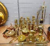 Large quantity of brass candlesticks, a trivet, a post horn, miners lamps, fire companion, etc.