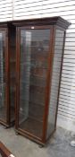 Glazed oak display cabinet with straight moulded cornice,