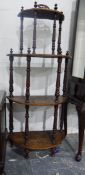 Late Victorian bowfront whatnot of four tiers, with painted decoration,