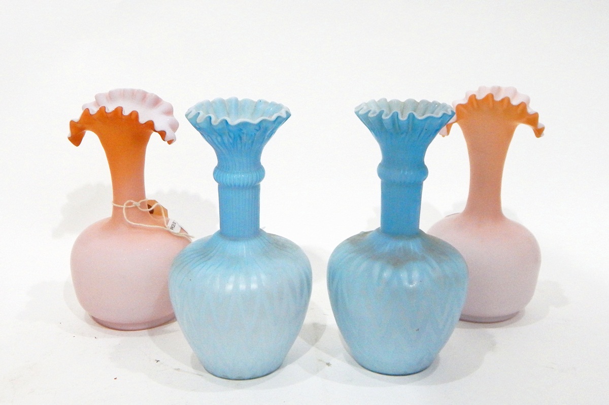 Pair of late Victorian blue satin glass vases of bottle form with flared folded necks, approx.