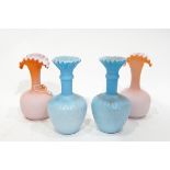 Pair of late Victorian blue satin glass vases of bottle form with flared folded necks, approx.