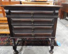Stained oak chest of three long drawers, raised on turned legs with bun feet,