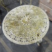 Pair of foliate pattern aluminium garden armchairs together with a similar circular table (3)