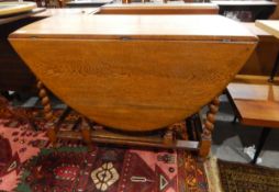 Oak drop-leaf oval topped gateleg table with moulded edge,