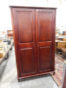 Contemporary double wardrobe the panel doors enclosing shelf and hanging space,