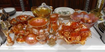 Large quantity of carnival glass including two punch bowls with various cups, comport, vases, etc.