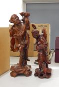 Two carved hardwood and bone Oriental figures,