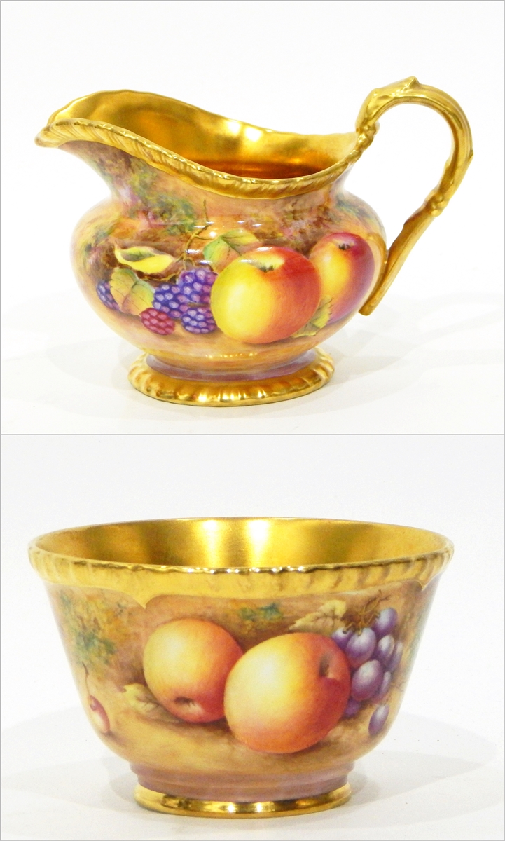 20th century Royal Worcester china jug of oblate baluster form with gilt handle and gadrooned rim