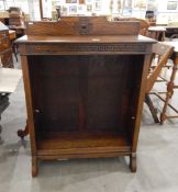 Early 20th century oak open front bookcase with carved back, Greek key pattern decoration,