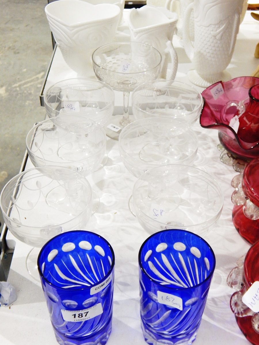 Set of six glass champagne bowls with etched decoration,