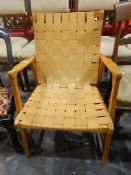 Contemporary armchair with webbed hessian upholstery