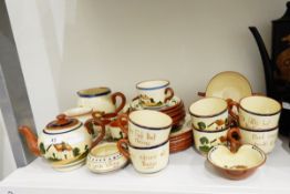 Quantity of Devon Watcombe pottery cottage and motto ware table teaware including eggcups,