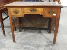 Georgian oak lowboy with moulded edge top, three frieze drawers, with open fretwork brackets,