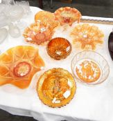 Collection of marigold carnival glass including a Fenton plate from the 'Famous Lovers Series'