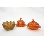 Collection of marigold carnival glass including two butter dishes,