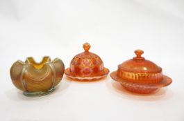 Collection of marigold carnival glass including two butter dishes,