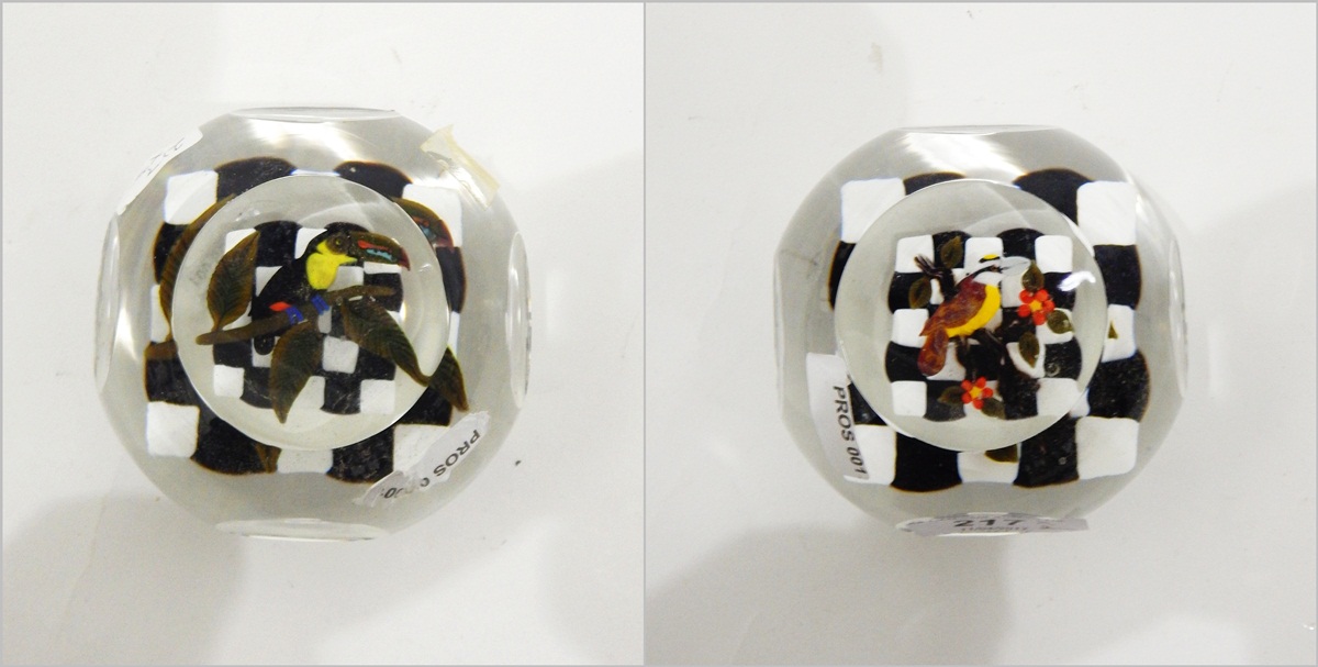 Matched pair of glass paperweights by John Deacons of circular form with faceted viewing panels,