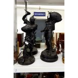 Pair of spelter figures of classical warriors, black painted, on turned wooden plinths,