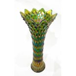 Large green carnival glass vase of flared dimpled design,