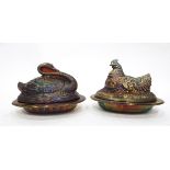 Two amethyst blue carnival glass butter dishes and covers, one modelled as a chicken with chicks,