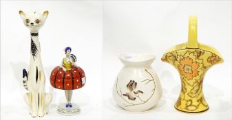 Porcelain lidded pot in the form of a 1920's dancer, a pottery model of a cat,