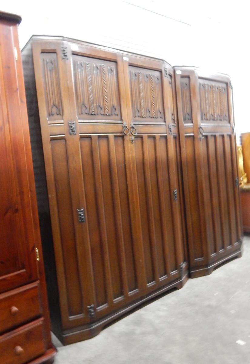Oak linenfold carved double wardrobe together with a matching single wardrobe (2)