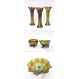Pair of Northwood green carnival glass flared vases, another similar green carnival glass vase,