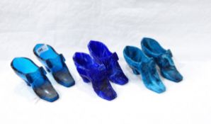 Three pairs of Victorian pressed glass models of lady's shoes, one in marbled green,