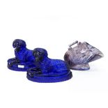 Pair of Victorian blue pressed glass dog ornaments, each recumbent dog on oval base,