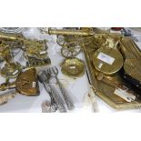 Quantity of brassware including Napoleon doorstop, a stirrup cup with a stag's head, tray, bellows,