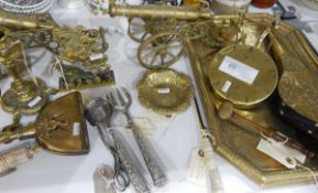 Quantity of brassware including Napoleon doorstop, a stirrup cup with a stag's head, tray, bellows,