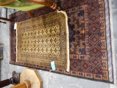 Handmade Eastern wool rug with maroon ground with three central guls surrounded by geometric design,