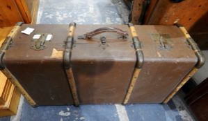 Leather travelling trunk and a canvas and wood trunk (2)