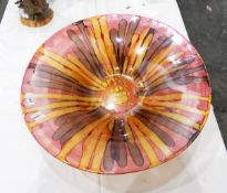 A modern glass bowl, of flared circular form, decorated in red,