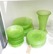 Early to mid 20th century moulded green glass table suite comprising a vase, two sizes of plates,