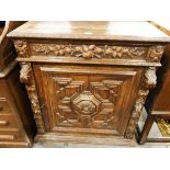 Victorian carved oak side cupboard, the frieze drawer with foliate carving,