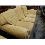 Modern three-seater settee with loose squab cushions,
