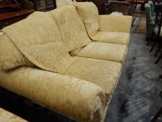 Modern three-seater settee with loose squab cushions,